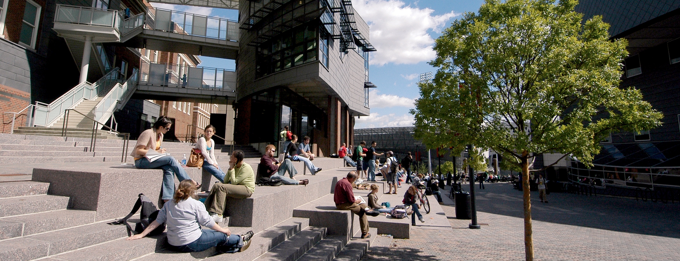 Main Street with students sitting on steps