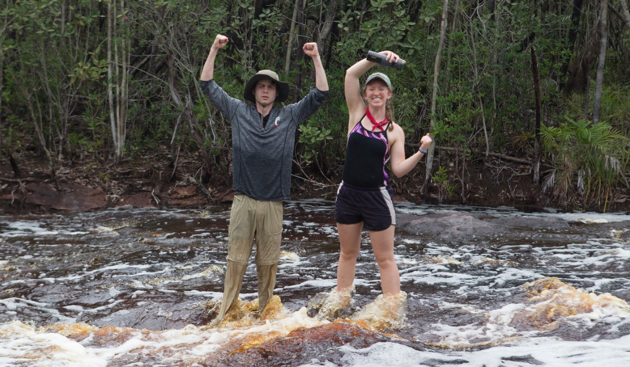 Students Holding Arms in UC Formation on Study Abroad Trip