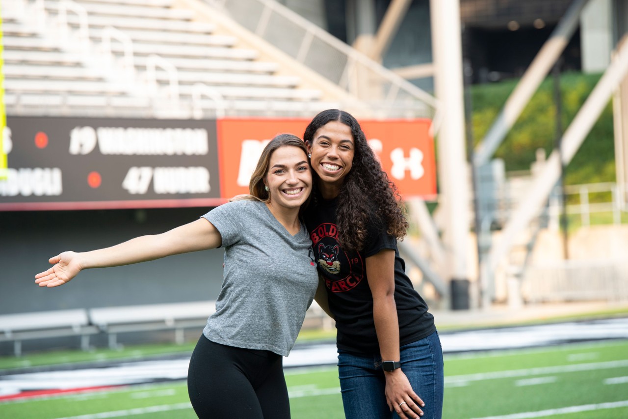 Two girls hugging and smiling